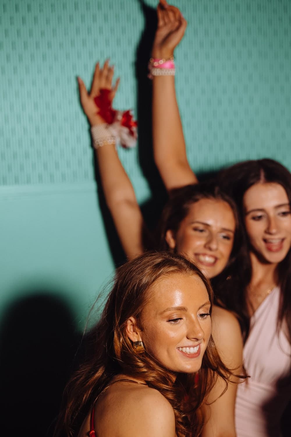 Friends dancing together at a DebsGuru event
