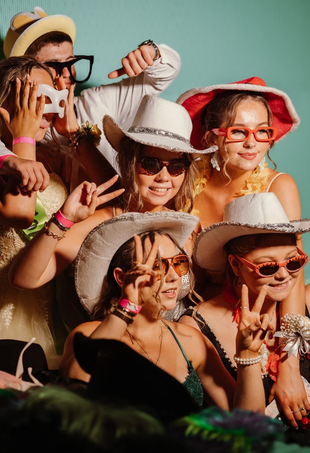 Friends posing together at the photo booth